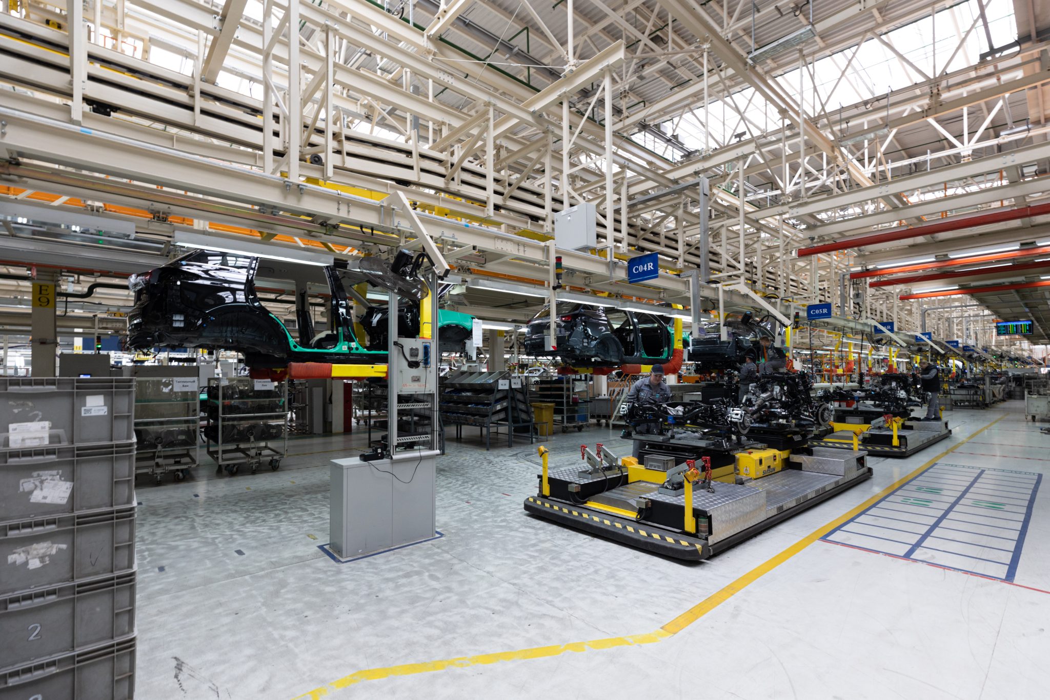 automobile production line. modern car assembly plant. interior of a high tech factory, manufacturing